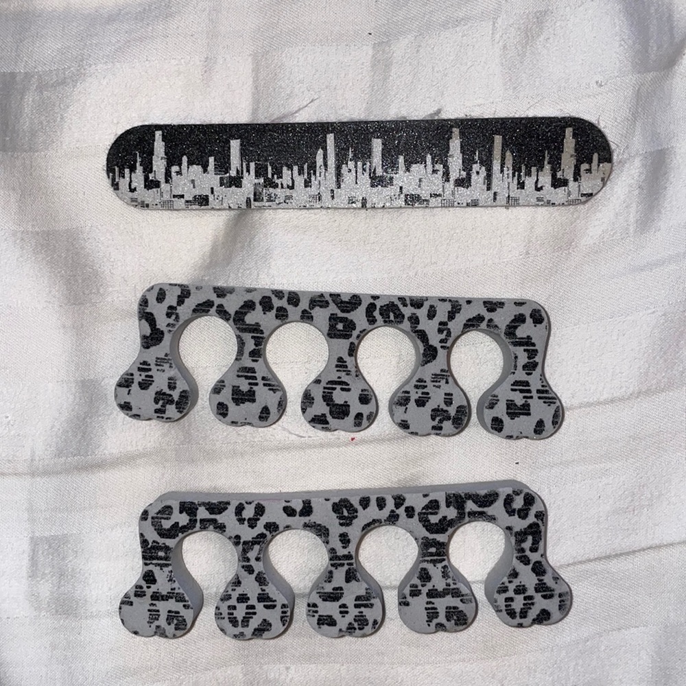 Nail file toe separation manicure pedicure mani pedi NYC New York City skyline